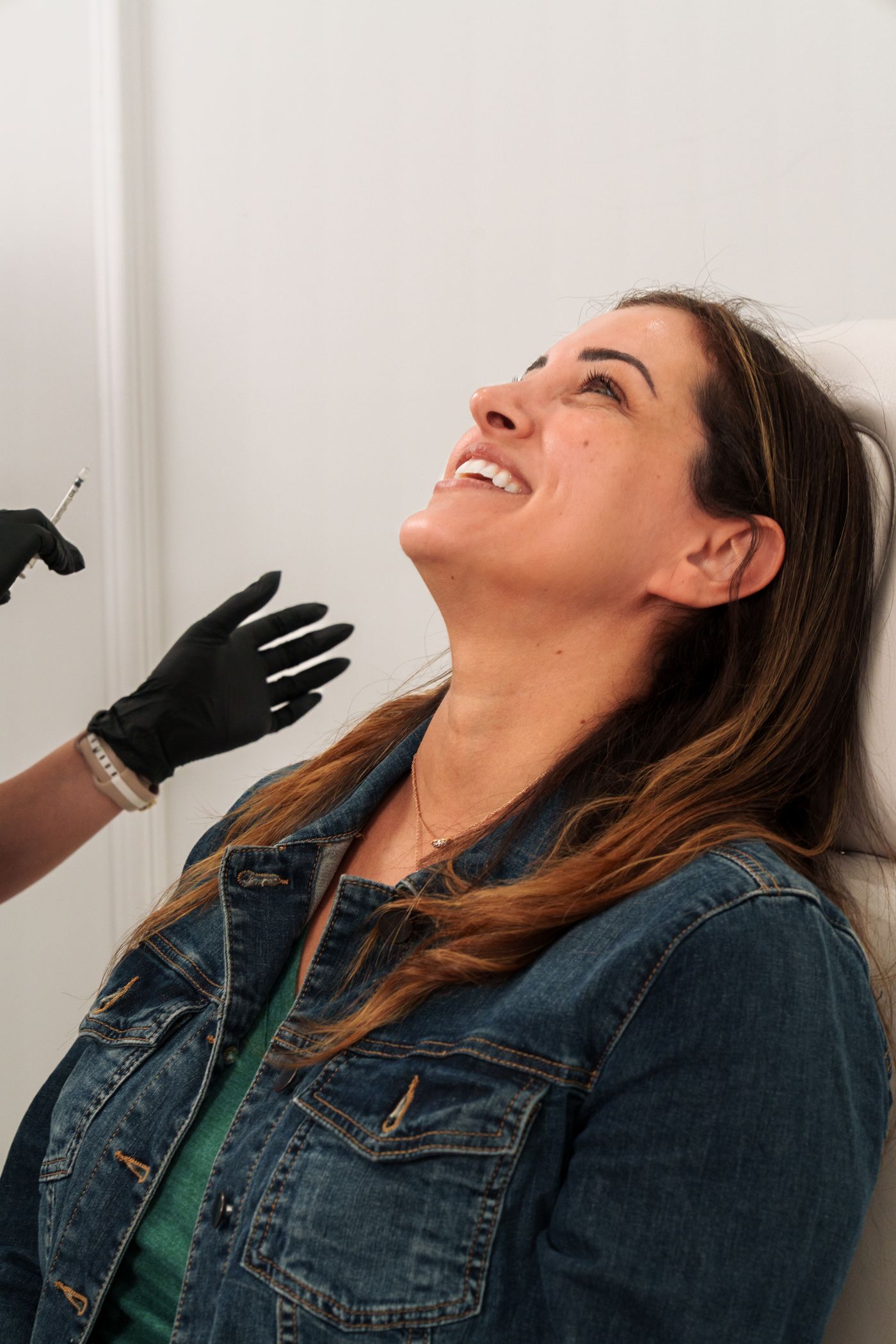A smiling patient at her consultation
